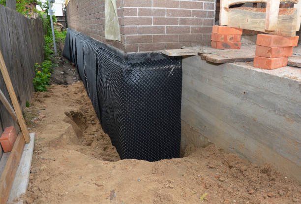 SJ Waterproofing Pros technician performing targeted Sump Pump Installation assessment in Elmwood, IL